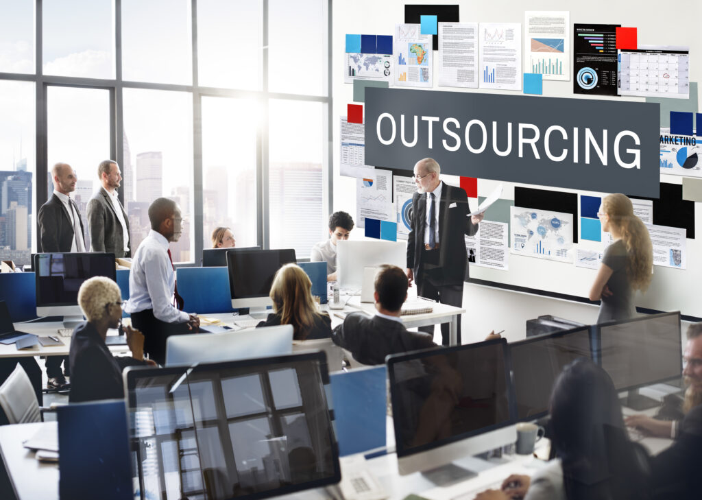 Why do companies outsource software development?